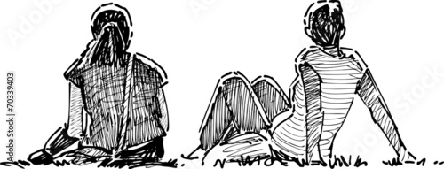 Girls have a rest on a grass