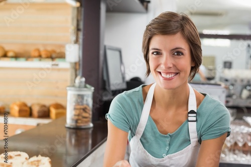 Pretty barista smiling at camera