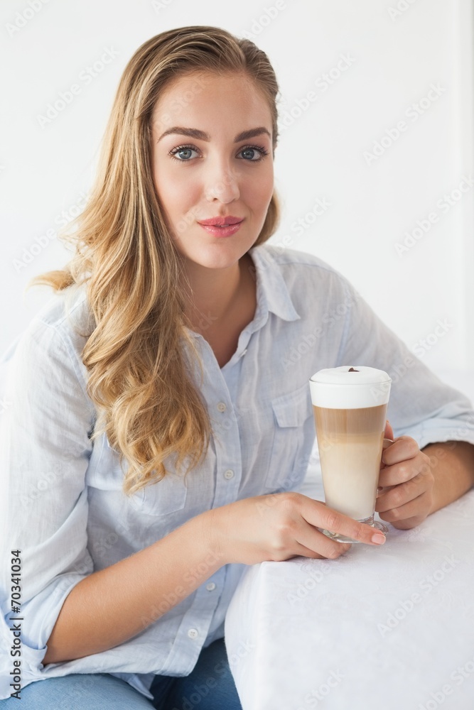Pretty blonde enjoying a latte Pretty blonde enjoying a latte