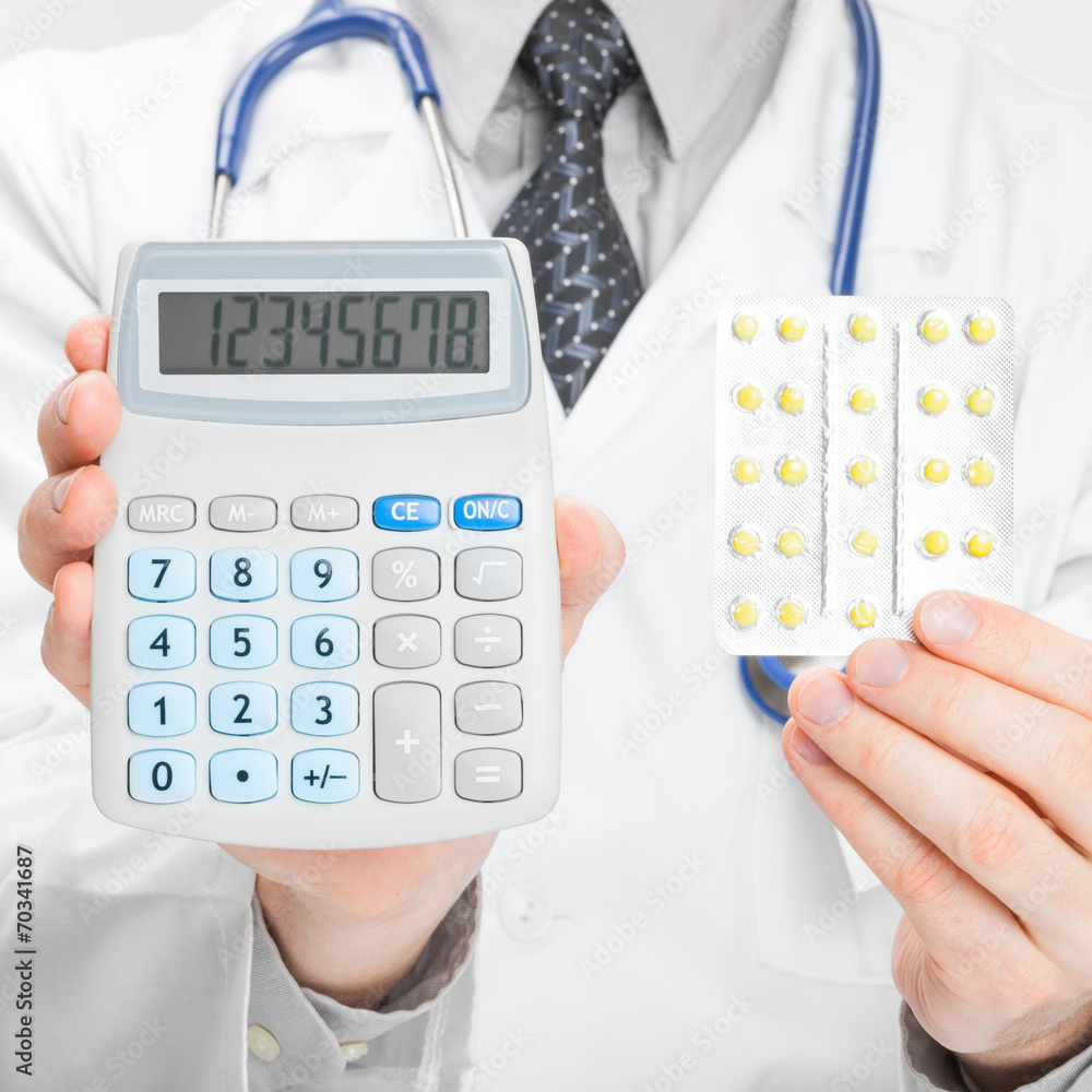 Doctor holdling calculator and pills in his hands - 1 to 1 ratio Doctor holdling calculator and pills in his hands - 1 to 1 ratio
