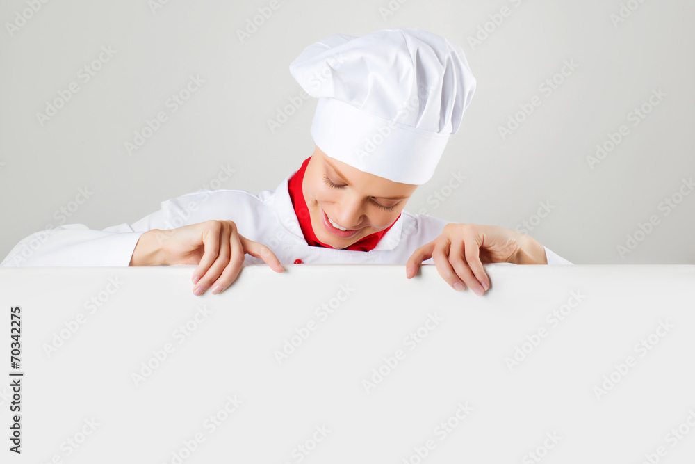 Smiling and cheerful female chef, cook or baker Smiling and cheerful female chef, cook or baker