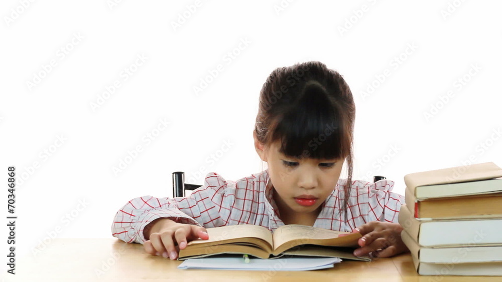 HD Dolly: Cute school girl writing home work read a book at home HD Dolly: Cute school girl writing home work read a book at home
