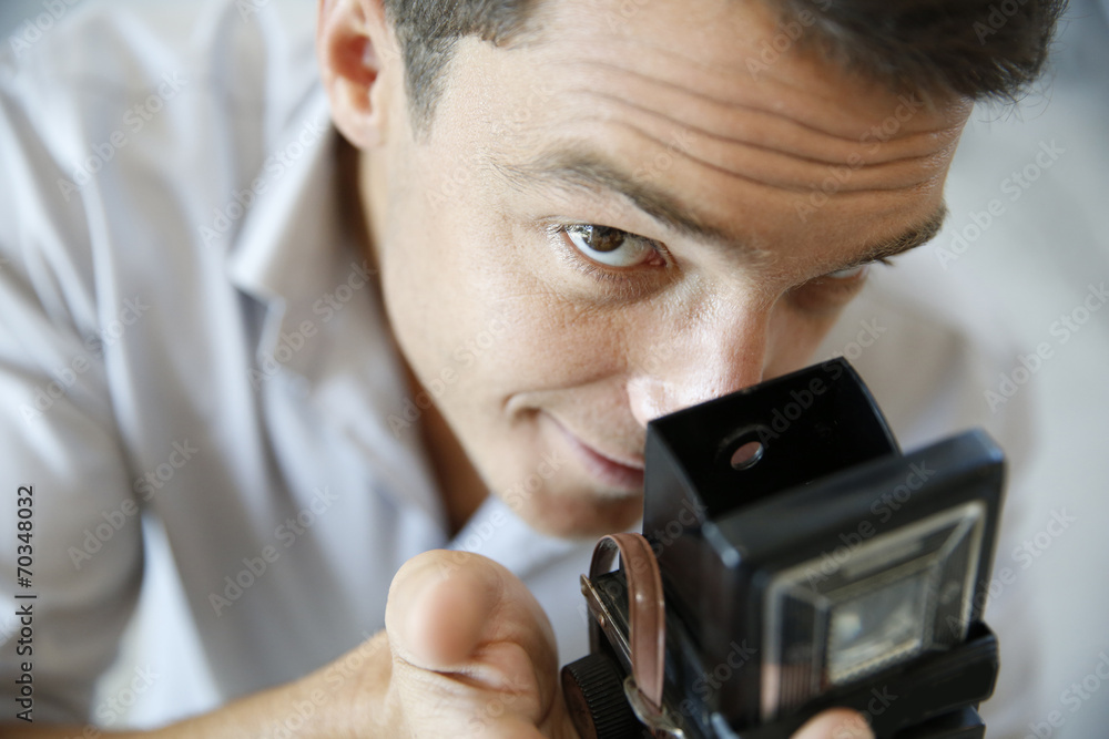 Fototapeta premium Closeup of photographer using vintage camera