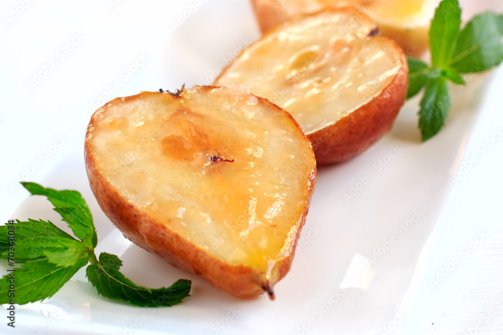 Baked pears and apples with butter and sugar