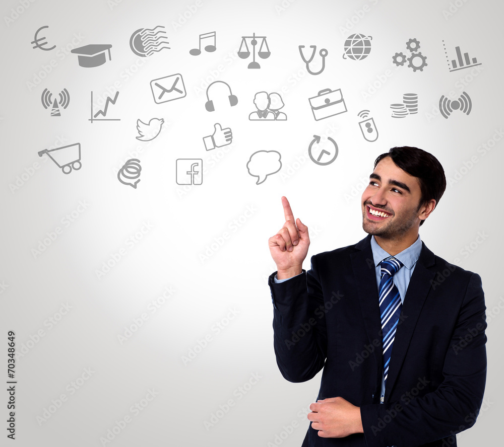 Man in suit choosing technology icons Man in suit choosing technology icons