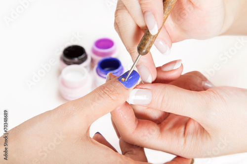 Nail gel salon.Applying nail art.