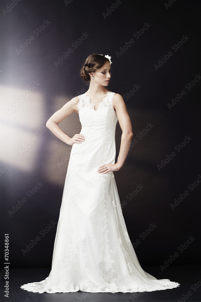 Glamorous bride in wedding dress, looking away. Glamorous bride in wedding dress, looking away.