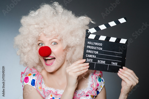 Clown with movie clapper board photo