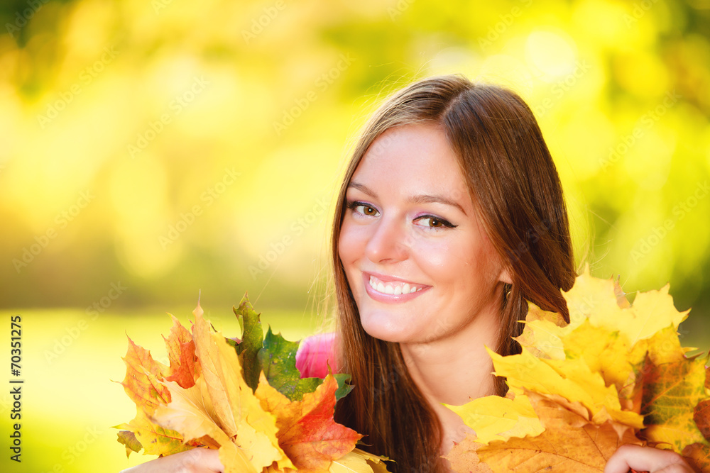 Fall season. Portrait girl woman holding autumnal leaves in park Fall season. Portrait girl woman holding autumnal leaves in park