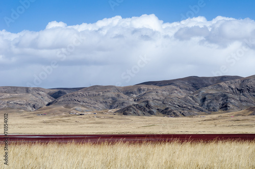 Tibetan highlands and interesting red-colored lake near Daotangh