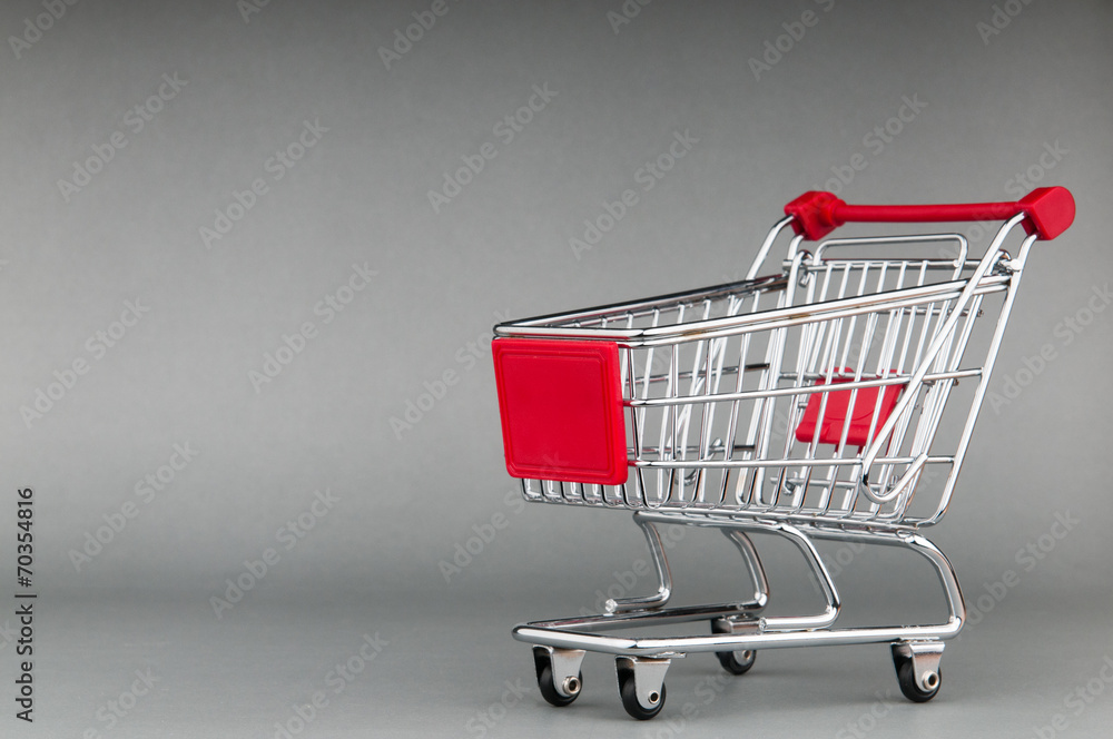 Shopping cart on seamless background Shopping cart on seamless background