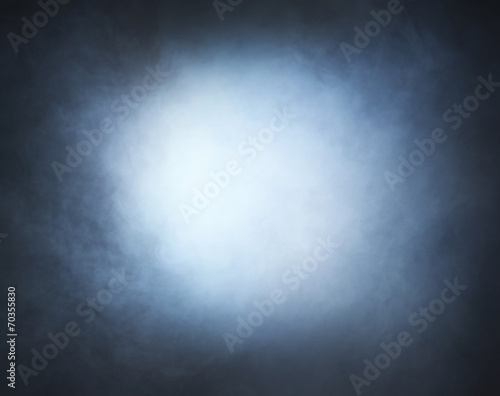 Light blue smoke over black background