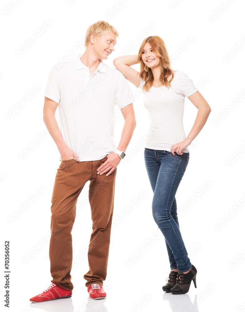 Stylish teenage couple standing isolated on white Stylish teenage couple standing isolated on white
