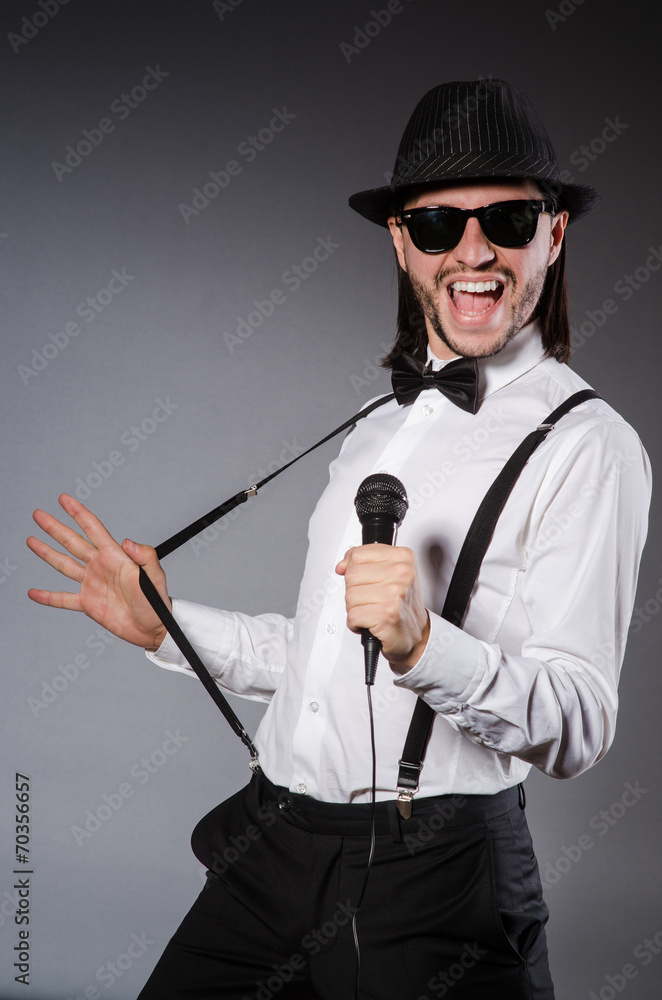 Funny singer with microphone at the concert Funny singer with microphone at the concert