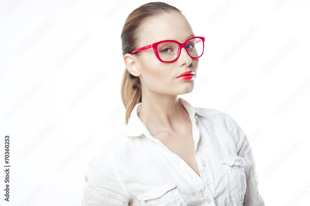 Business woman in glasses and a bright white shirt on a white ba Business woman in glasses and a bright white shirt on a white ba
