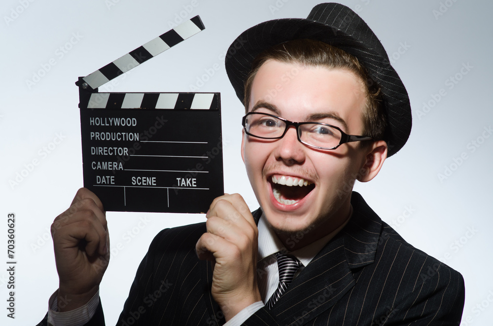 Man with movie clapperboard and hat Man with movie clapperboard and hat