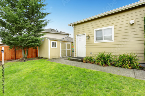 Fenced backyard with small shed