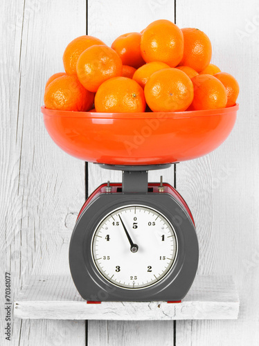 Tangerines on scales