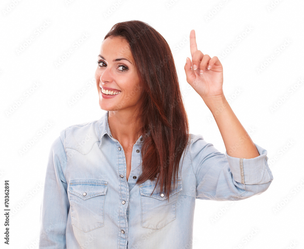 Lovely single lady pointing up and smiling Lovely single lady pointing up and smiling