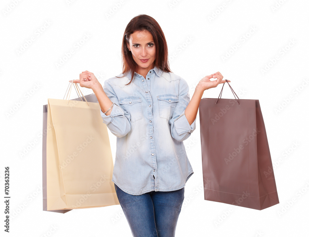 Charming adult brunette holding shopping bags Charming adult brunette holding shopping bags