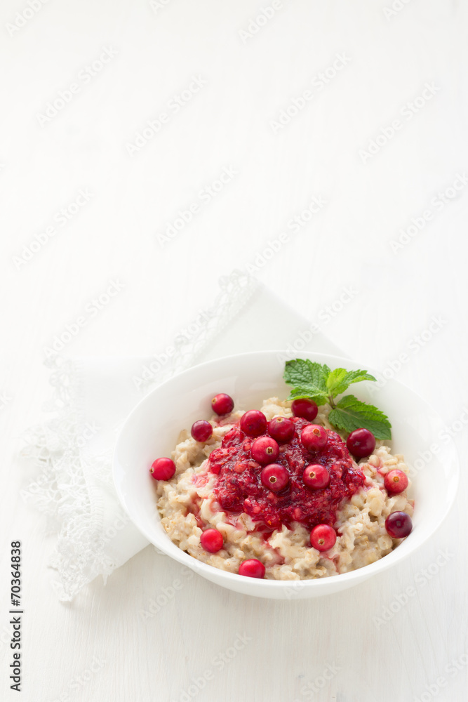 Oatmeal with cranberry jam, fresh cranberries and honey Oatmeal with cranberry jam, fresh cranberries and honey