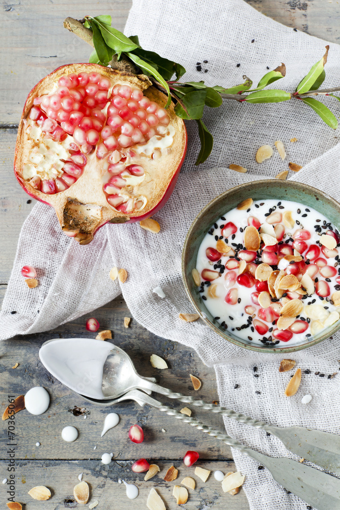pomegranate and white yogurt with grains and almonds pomegranate and white yogurt with grains and almonds