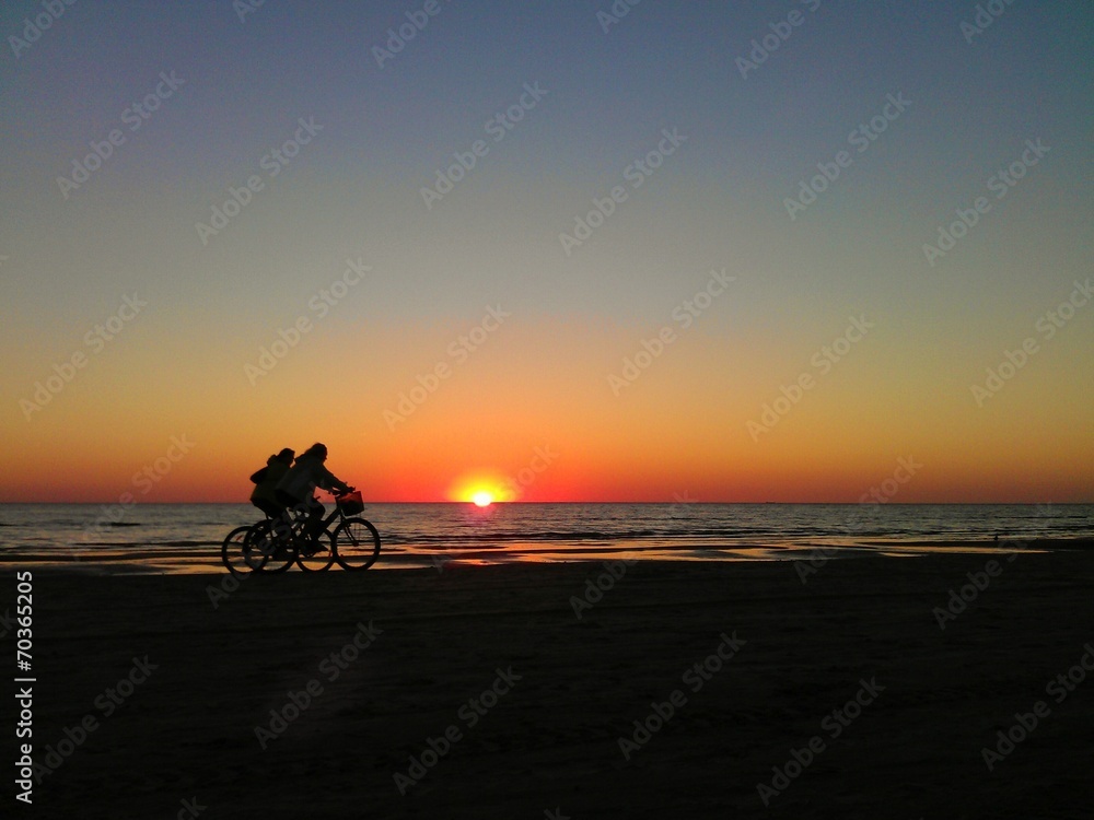 Ridding bikes at sunset