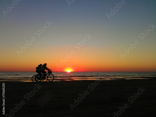 Ridding bikes at sunset