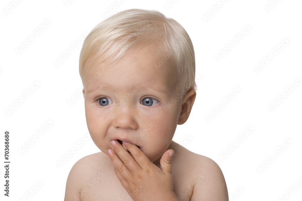 One year old boy eating himself corn snack One year old boy eating himself corn snack