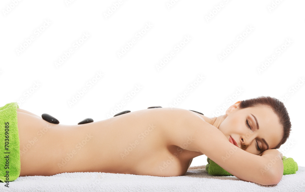 Girl on a stone therapy, hot stone massage Girl on a stone therapy, hot stone massage