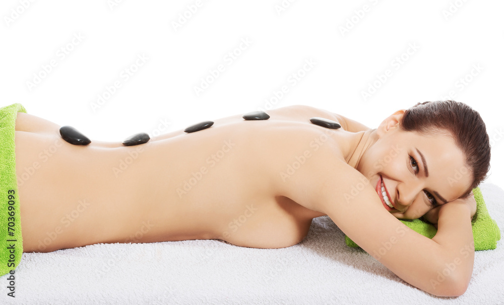 Girl on a stone therapy, hot stone massage Girl on a stone therapy, hot stone massage