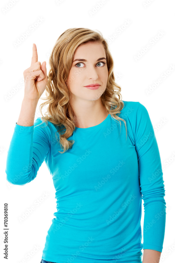 Fototapeta premium Casual woman presenting a copyspace.