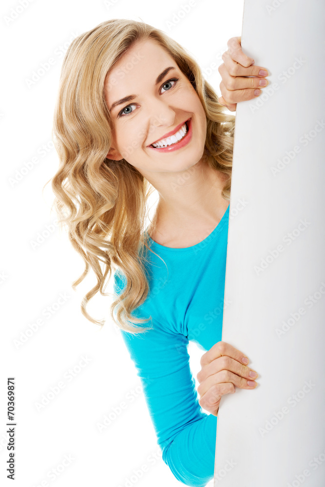 Portrait of happy woman with blank board Portrait of happy woman with blank board