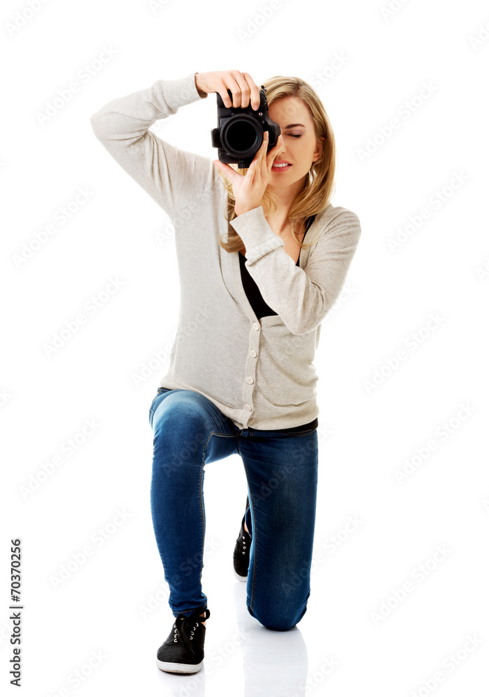 Woman photographer with DSLR Woman photographer with DSLR