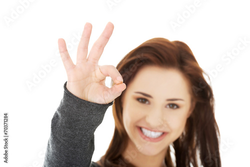 Happy woman with perfect hand sign