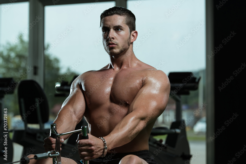 Young Male Doing Back Exercises In The Gym Young Male Doing Back Exercises In The Gym