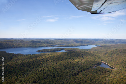 Adirondack forests and lakes summer aerial view from light aircr