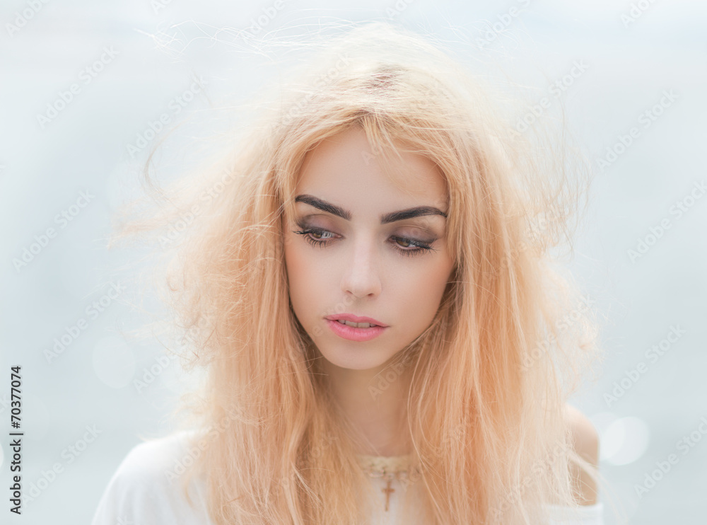 Portrait of a beautiful blonde girl close-up.
