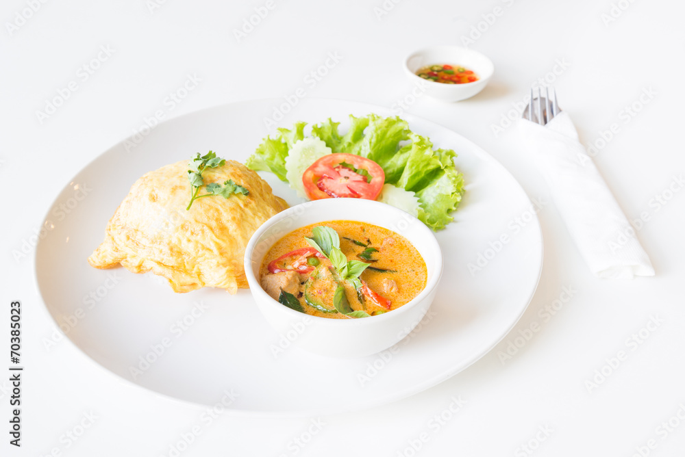 Delicious rice and red curry with pork and omelet (Thai panang c Delicious rice and red curry with pork and omelet (Thai panang c