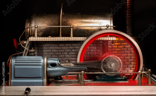 View of the flywheel of a steam engine photo