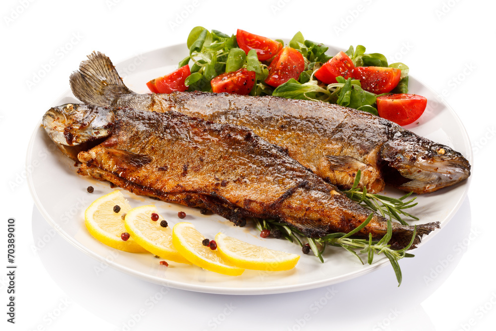 Fish dish - fried fish fillet with vegetables Fish dish - fried fish fillet with vegetables