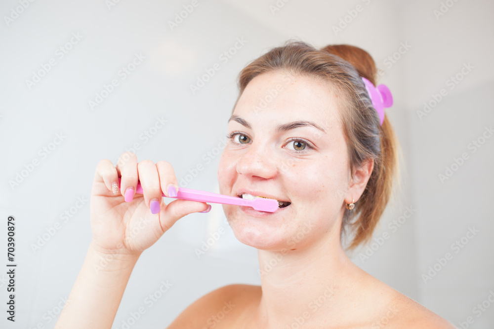 Beautiful/attractive young woman/girl cleaning her teeth/dental hygiene in bathroom Beautiful/attractive young woman/girl cleaning her teeth/dental hygiene in bathroom