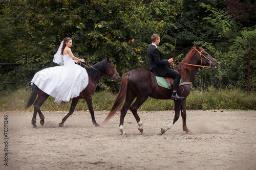 wedding couple on horses