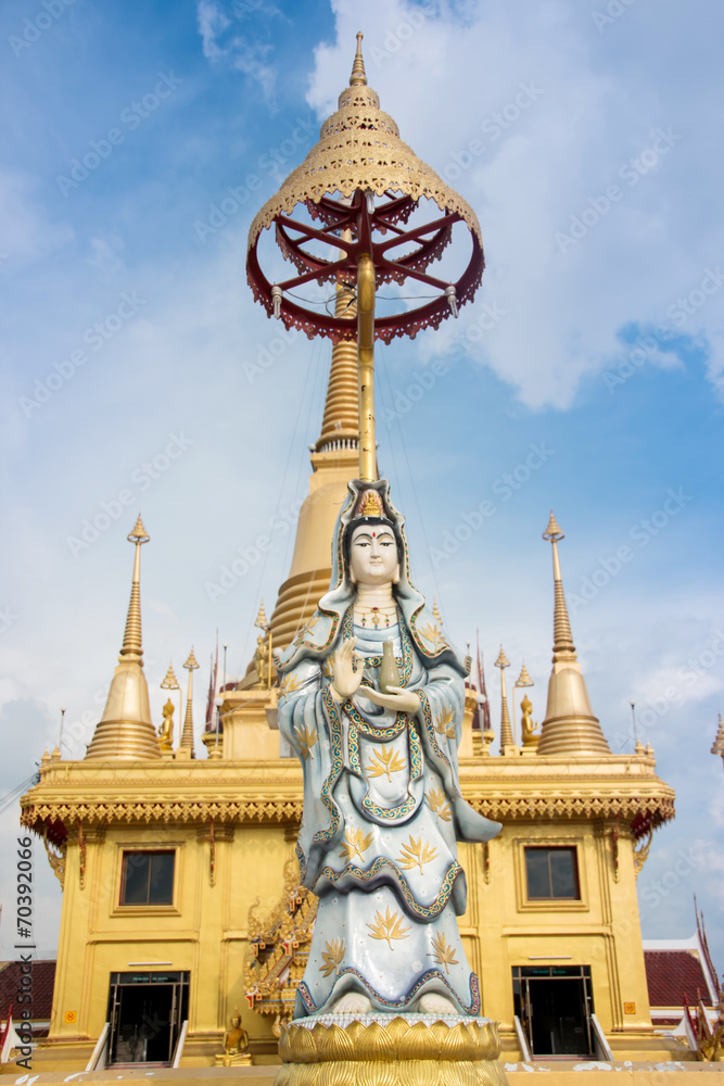 Fototapeta premium Guan Yin statue with blue sky, Thailand