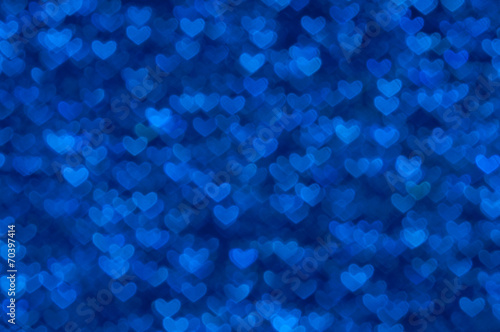 defocused abstract blue hearts light background