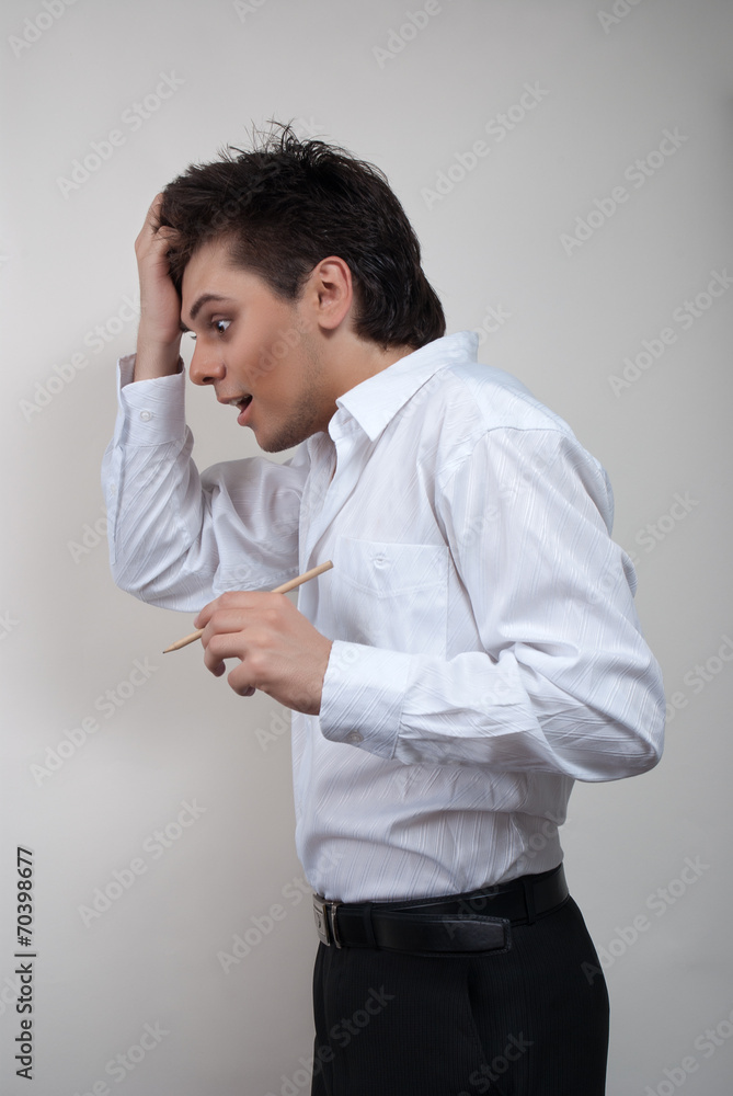Handsome man in white shirt. Studio white background. Handsome man in white shirt. Studio white background.