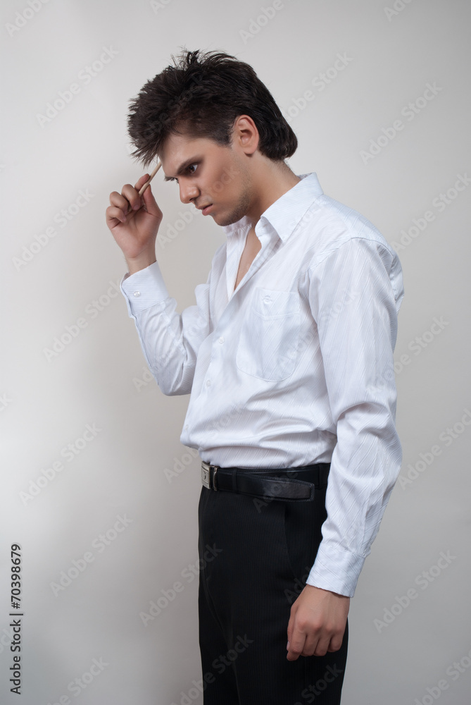 Handsome man in white shirt. Studio white background. Handsome man in white shirt. Studio white background.