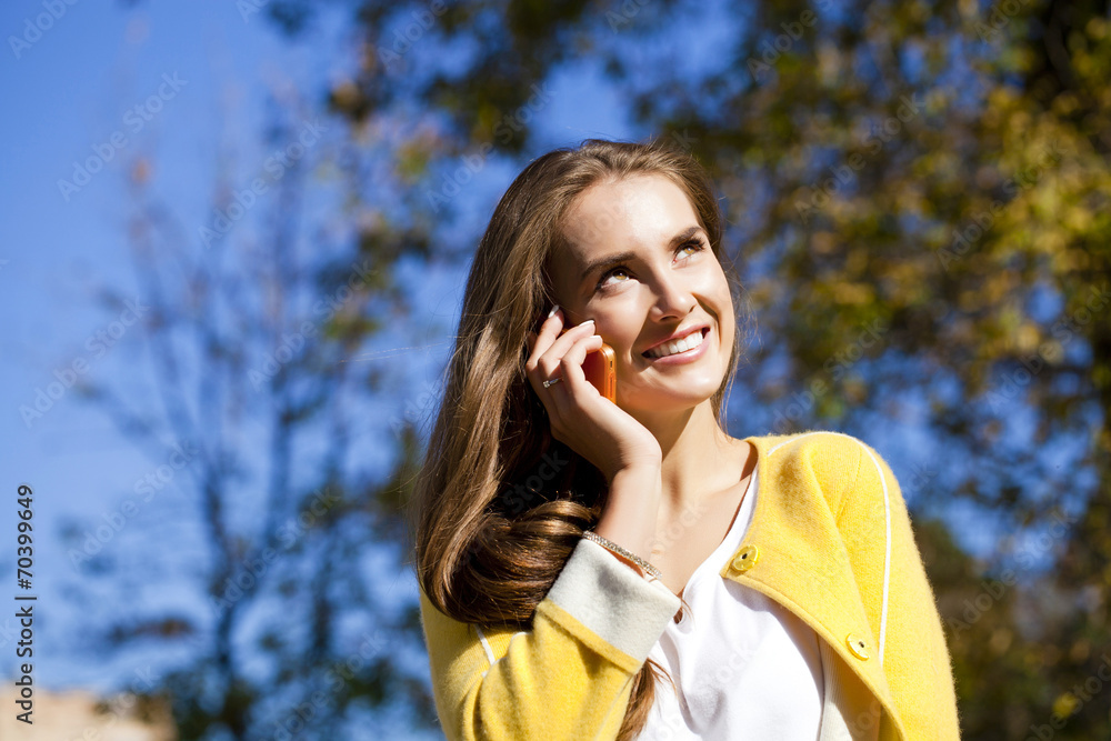 Happy beautiful woman calling by phone Happy beautiful woman calling by phone