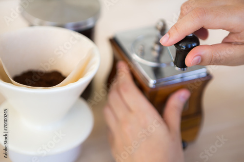 Woman hand of barista preparation drip coffee