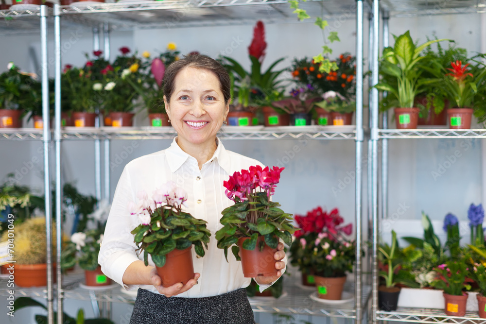  woman with Cyclamen surrounded by different flowers